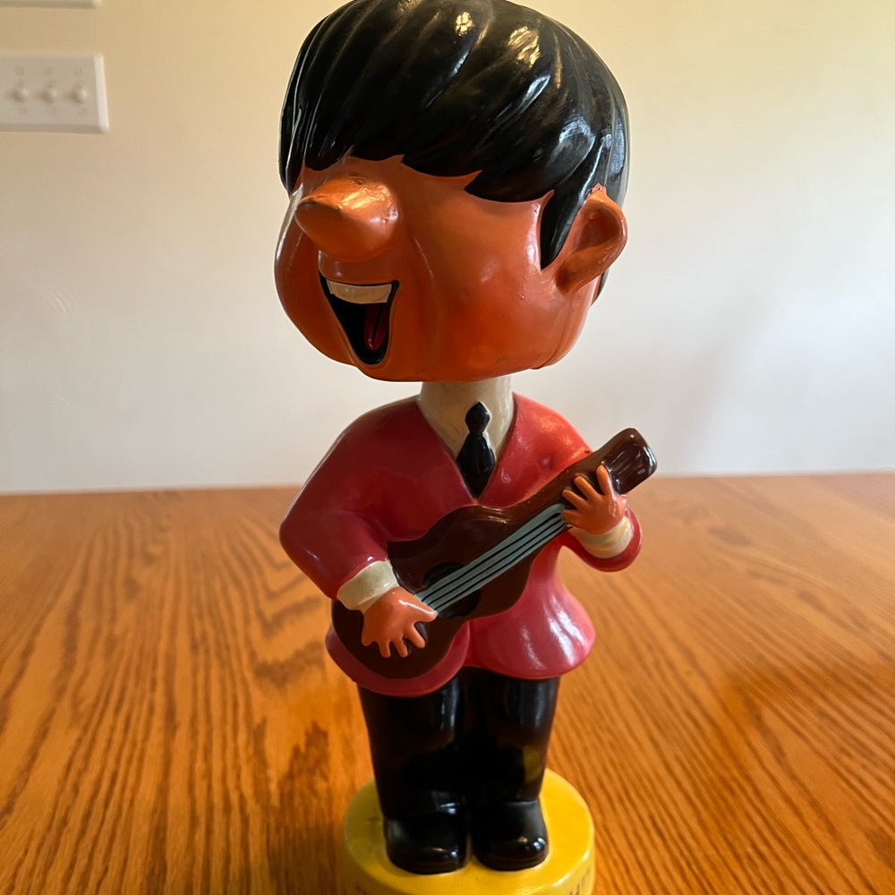Vintage Beatles bobble head piggy bank.